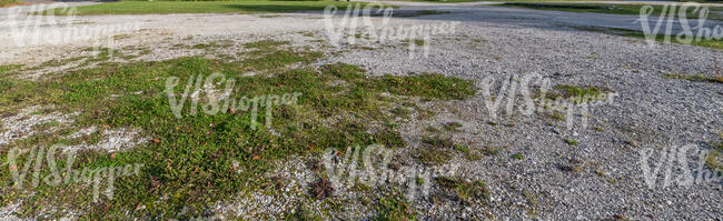 area with gravel and some grass