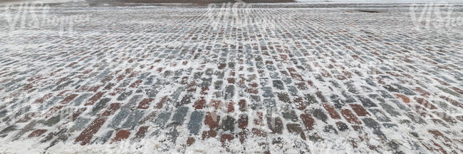 snowy historic pavement