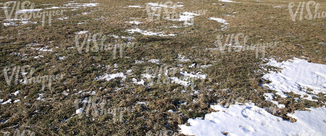 ground partially covered with snow