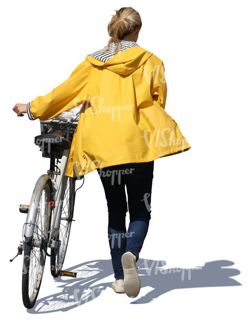 woman with a yellow raincoat pushing a bike