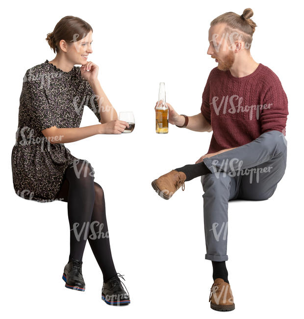 young man and woman sitting and talking in a cafe