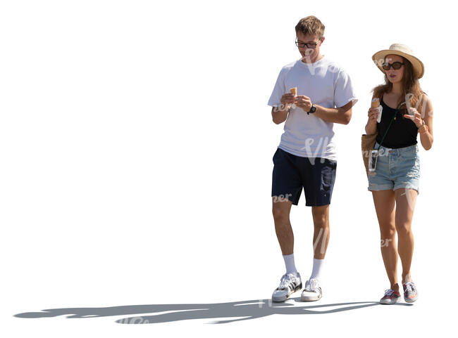 cut out backlit man and woman walking and eating ice cream