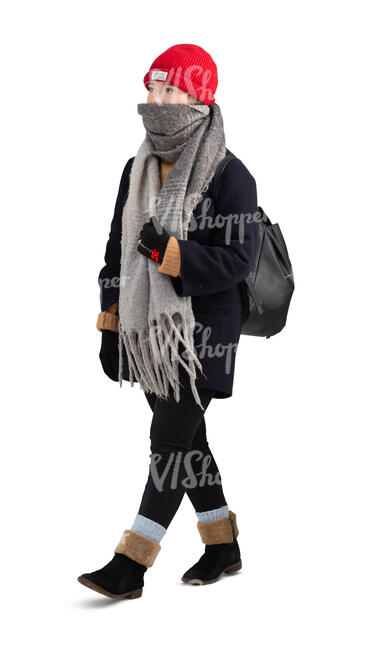 cut out teenage girl with a hat and big scarf walking