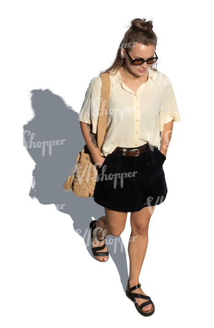 cut out top view of a woman walking hands in her pocket