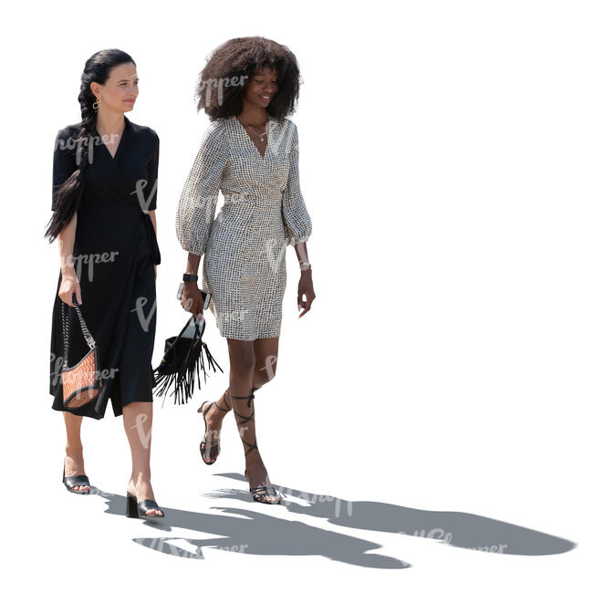 two cut out backlit women walking