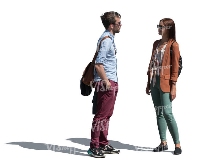 two people standing outside and talking