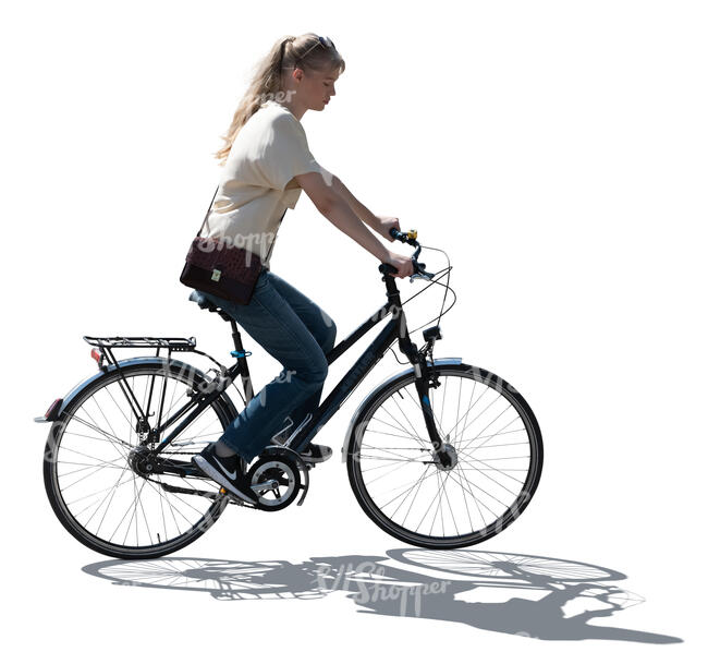 backlit woman riding a bicycle