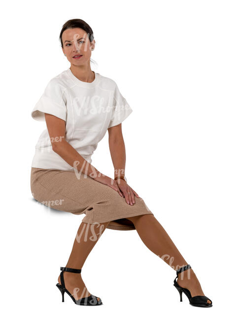 woman in a beige skirt sitting