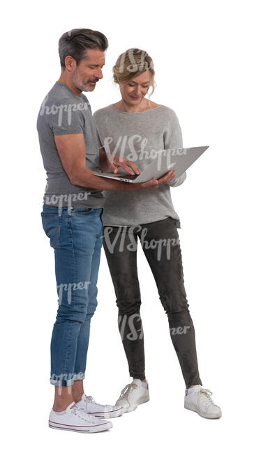 man and woman standing and looking at a computer together