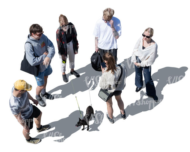 group of young people and a dog standing seen from above