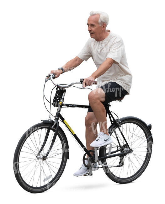 grey haired man riding a bike