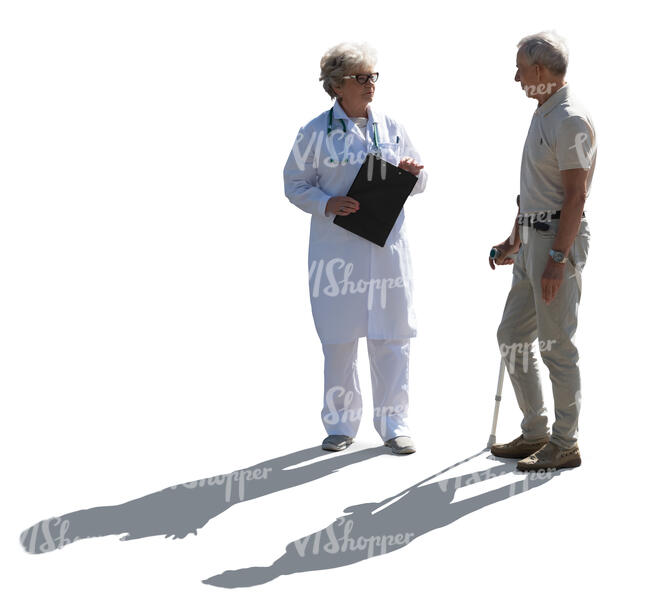 backlit doctor talking to an elderly male patient