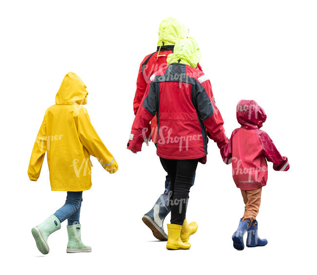 family with kids wearing rain coats walking