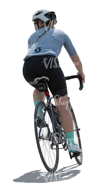 backlit female cyclist riding a bike