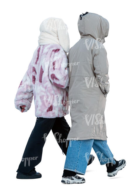 two women wearing winter hat walking