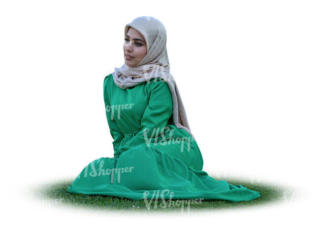 muslim woman with a hijab sitting on the grass