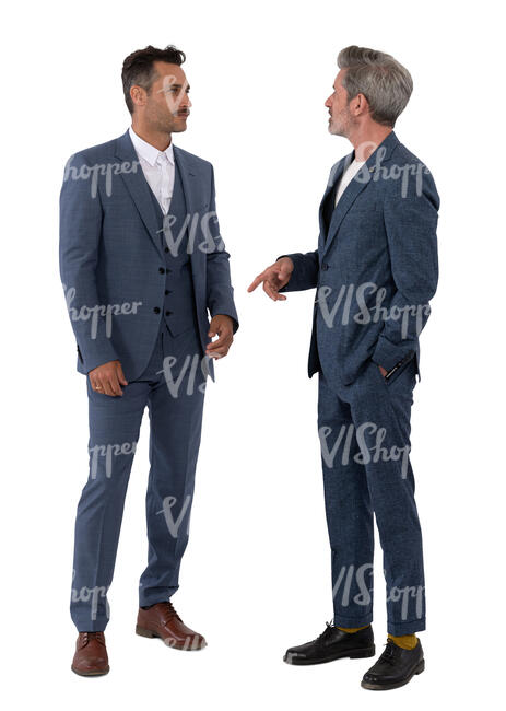 two men in suits standing and talking