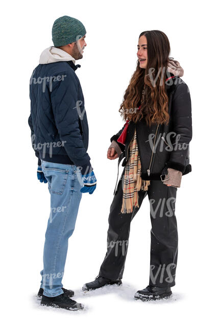 man and woman standing in the snow and talking