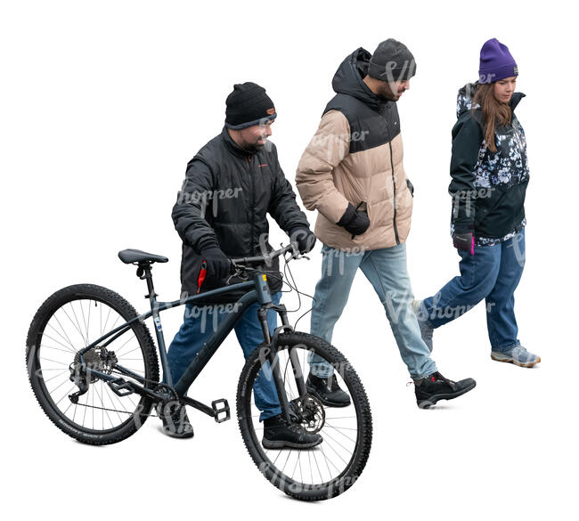 group of three people walking in winter seen from above