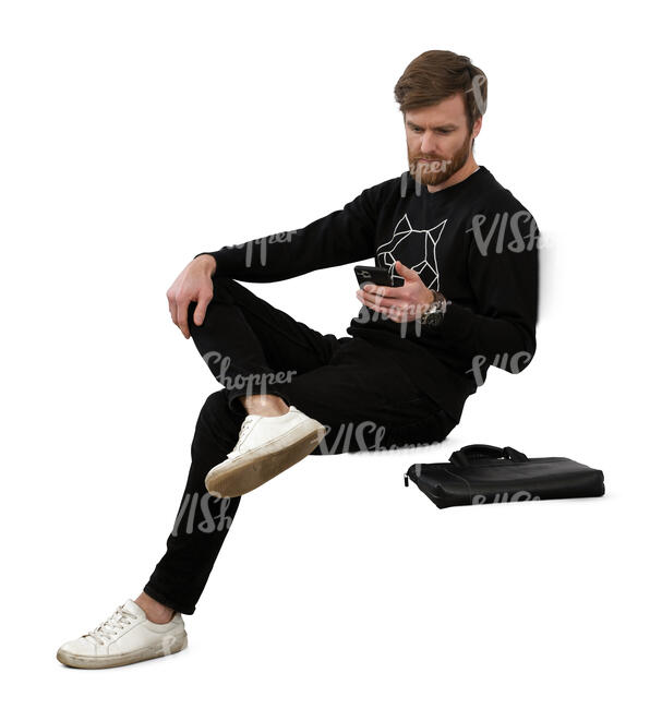 cut out man sitting and texting