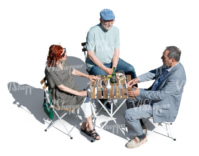 three older people sitting in a cafe seen from above