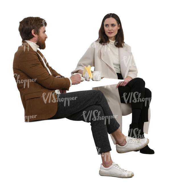 two cut out  people sitting in a coffee house