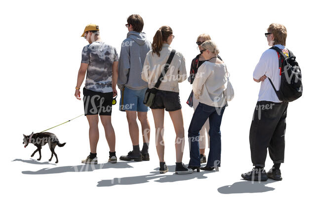 backlit queue of people standing