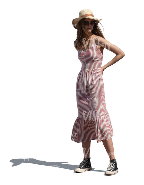 cut out woman in a summer dress and wearing a hat standing