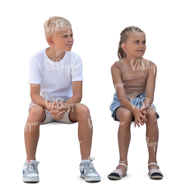 two cut out children sitting