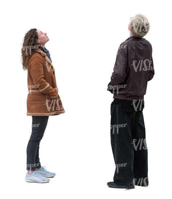 two people standing and looking up