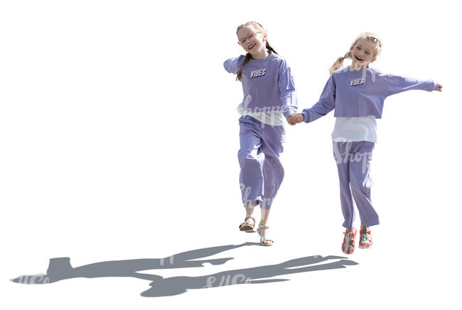 two backlit girls walking playfully