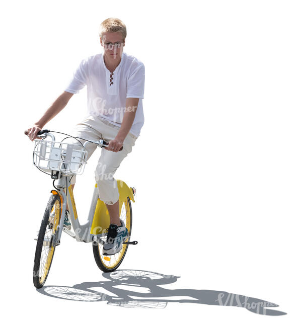 backlit young man riding a bike