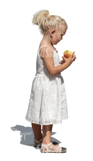 cut out little girl in a white dress eating an apple