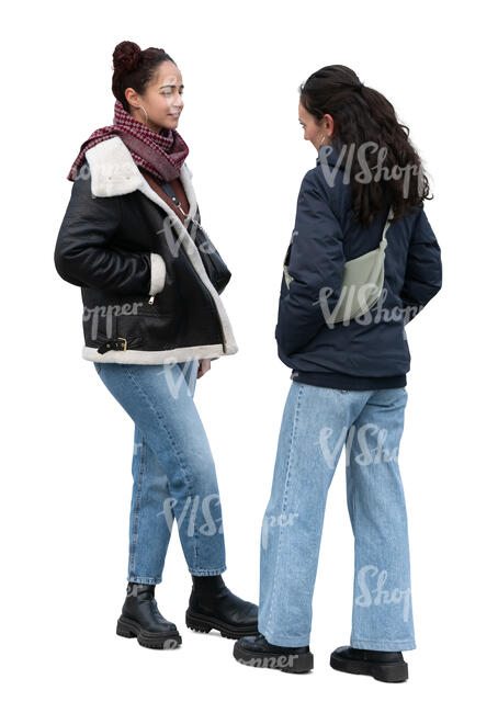 two dark haired women talking in autumn