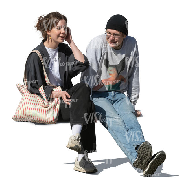 two young people sitting and talking