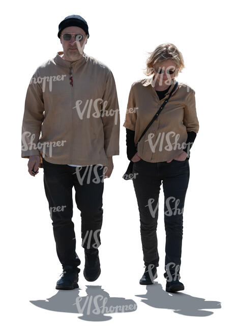 two cut out backlit people walking