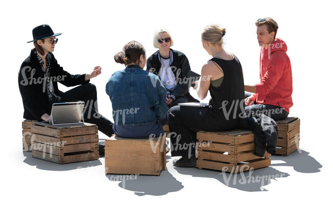 cut out backlit group of young people sitting on wooden boxes