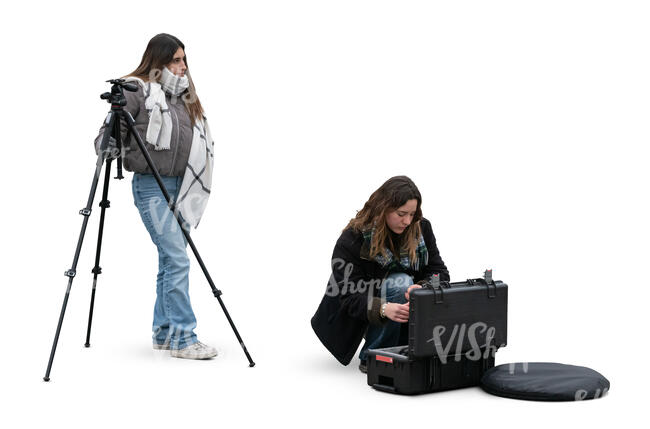 two cut out women preparing for a photo shoot