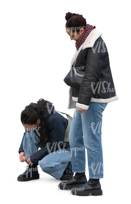 woman tying her shoe laces and her friend standing and waiting