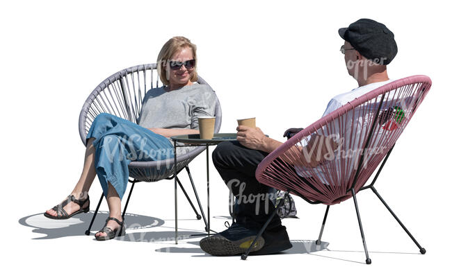 two people sitting in an outdoor cafe