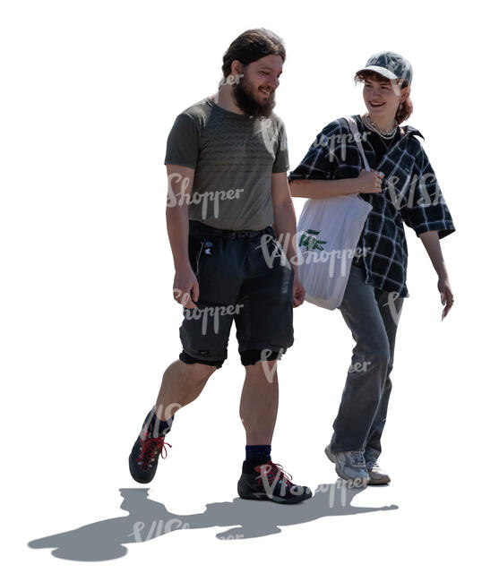 backlit man and woman walking