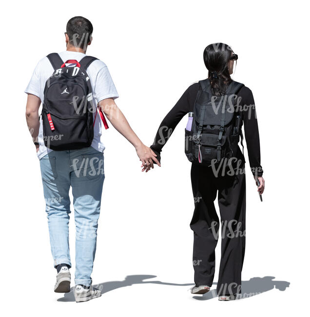 man and woman with backpacks walking hand in hand