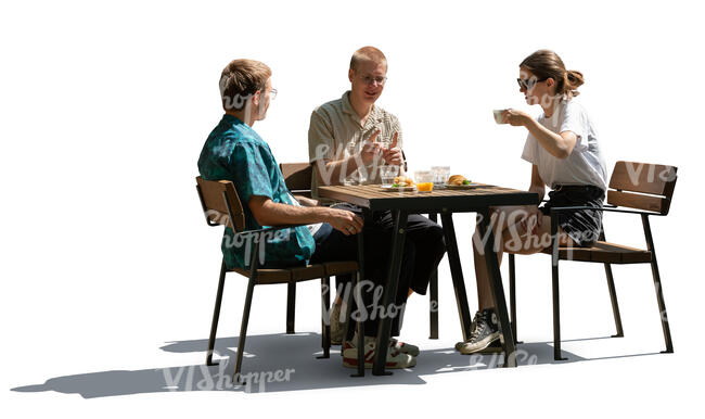 cut out backlit group of three people sitting in a cafeteria and eating