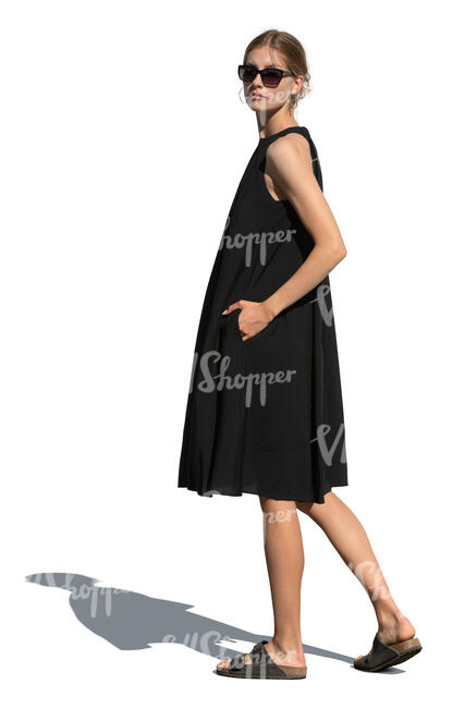 cut out woman in a black dress standing and looking back over the shoulder