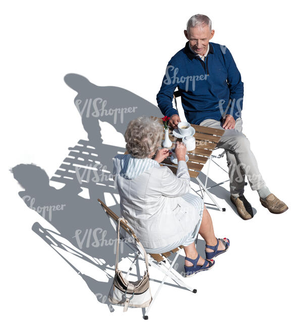 top view of two older people sitting in aa cafe