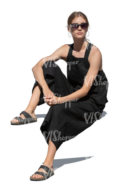 cut out woman in a black summer outfit sitting