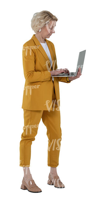 cut out woman in a yellow business costume standing and holding a laptop