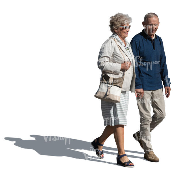 elderly grey haired couple walking