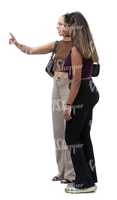 two women standing and pointing at smth