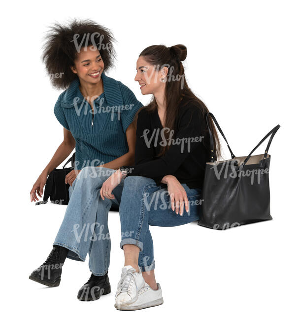 two women sitting and talking